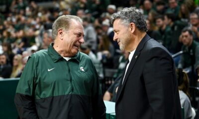 Michigan State basketball coach Tom Izzo speaks with Oakland's Greg Kampe before the 2023 matchup in East Lansing.