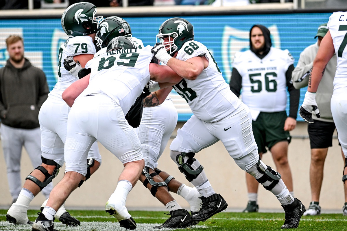 Michigan State football linemen Jacob Merritt and Gavin Broscious go through a drill.