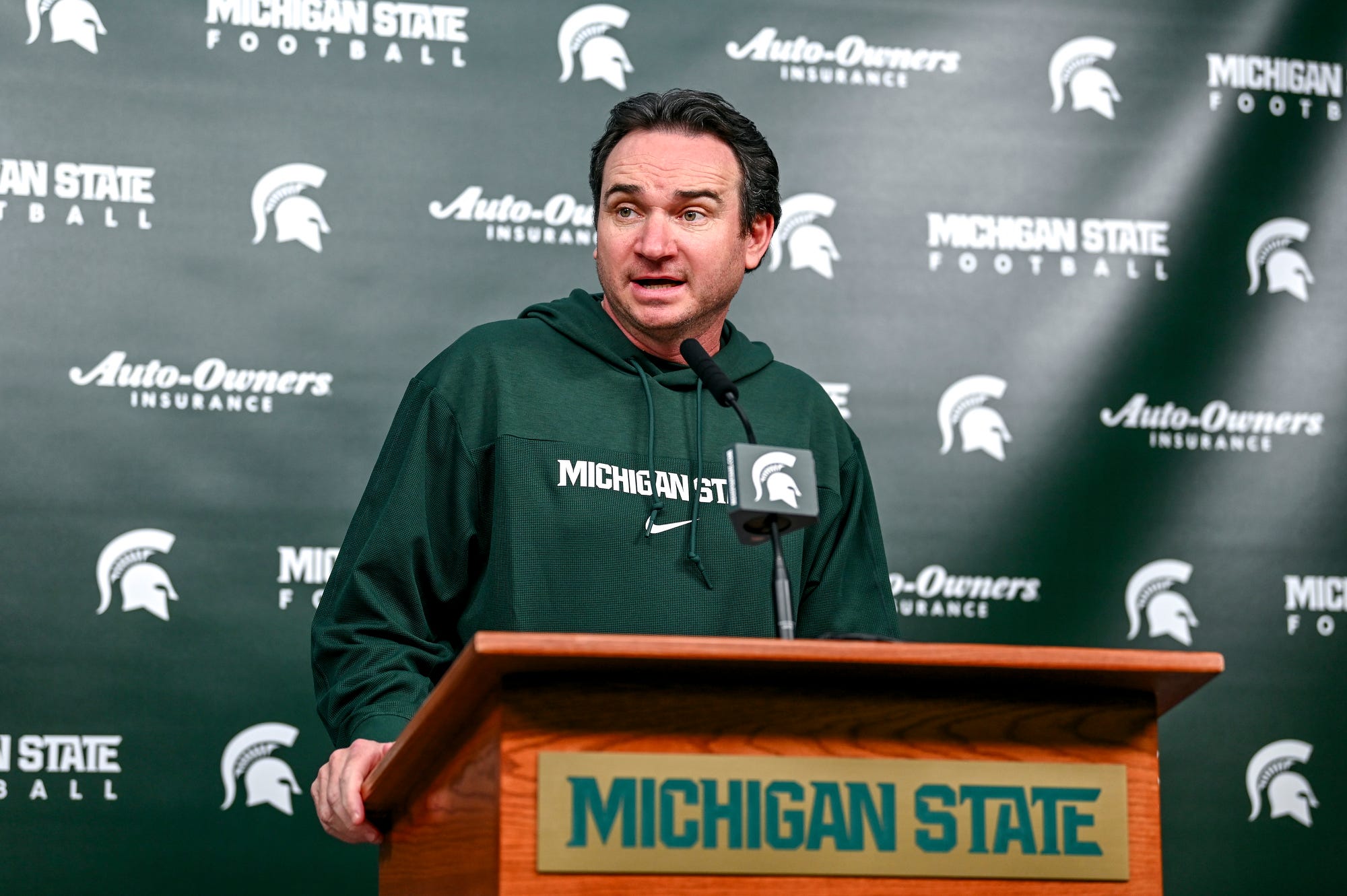 Michigan State football coach Jonathan Smith talks to the media.