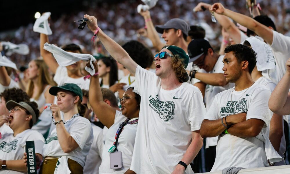 Michigan State football fans celebrate.