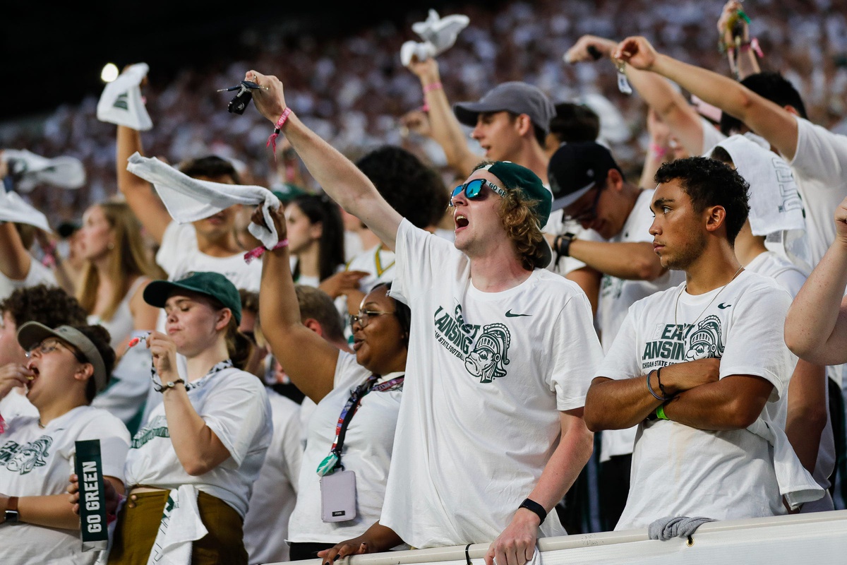 Michigan State football fans celebrate.