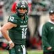 Former Michigan State football quarterback Katin Houser warms up before a game.