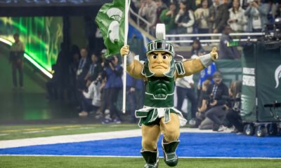 Michigan State football mascot Sparty runs out onto Ford Field.