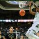 Michigan State basketball star Coen Carr dunks the ball against Oakland.