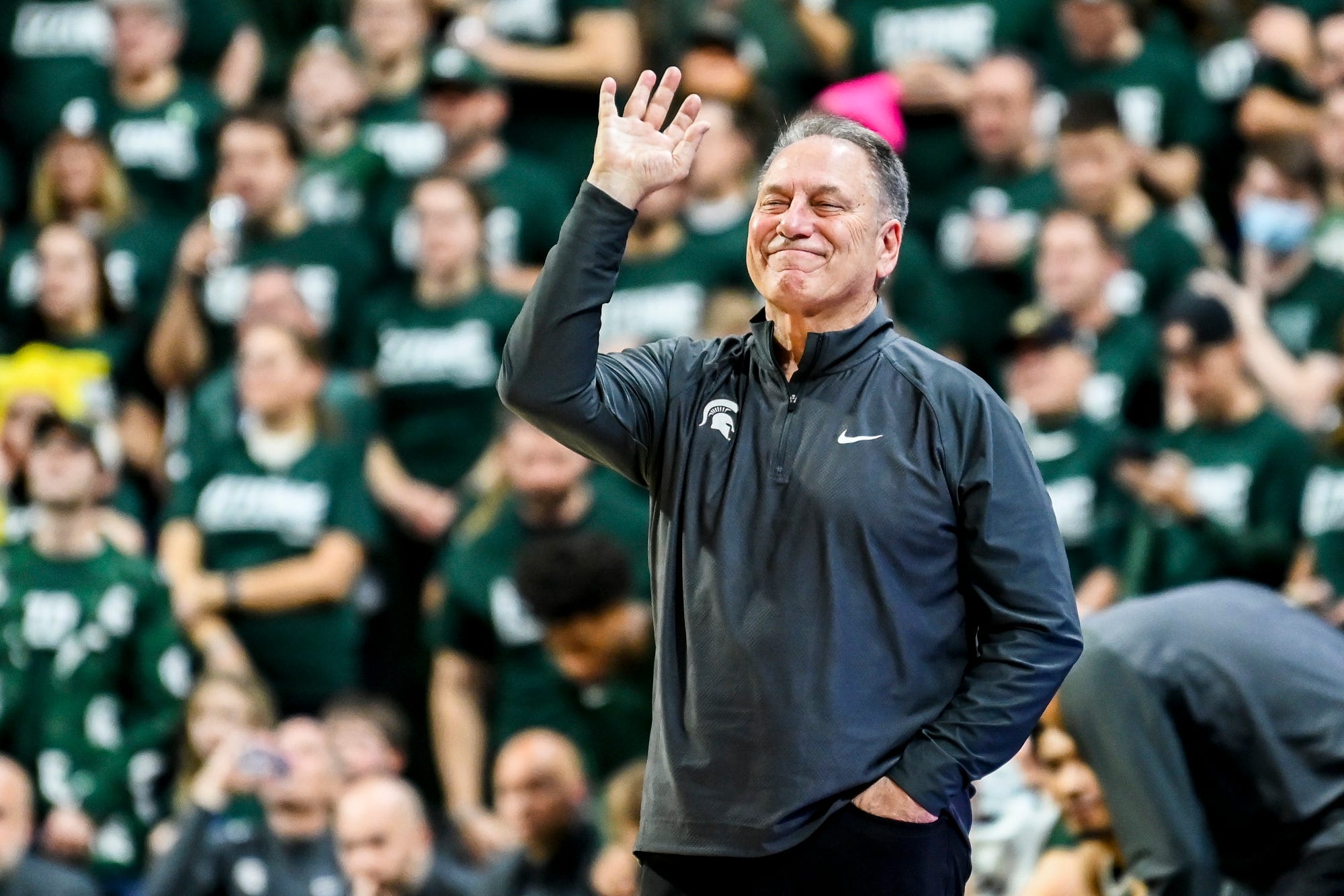 Michigan State basketball coach Tom Izzo on the sidelines reacts to a call.