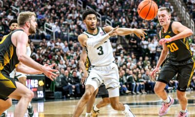 Michigan State basketball star Jaden Akins passes the ball vs. Iowa