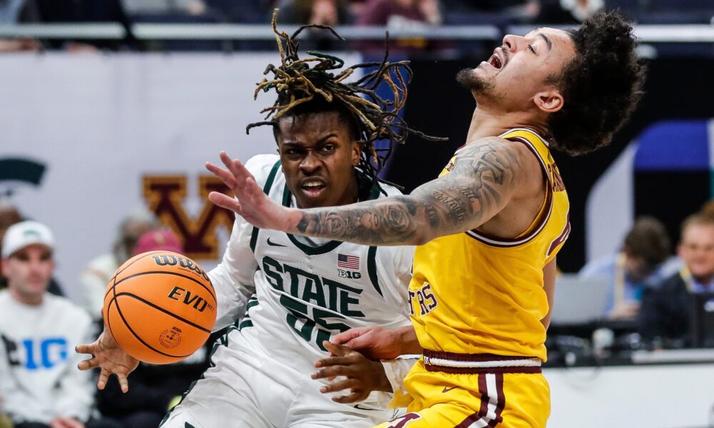 Michigan State basketball star Coen Carr drives to the hoop.