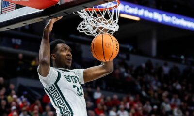 Michigan State basketball star Xavier Booker dunks.