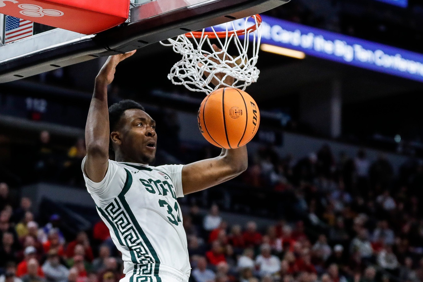 Michigan State basketball star Xavier Booker dunks.