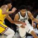 Michigan State basketball star Jaden Akins dribbles the ball against Minnesota.