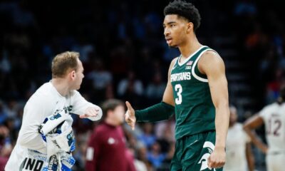 Michigan State basketball star Jaden Akins celebrates a basket.