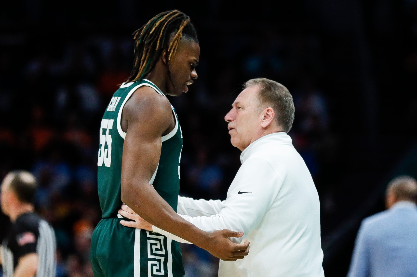 Michigan State basketball star Coen Carr speaks with Tom Izzo.