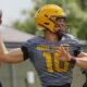 Former Michigan State football quarterback Sam Leavitt warms up in fall camp.