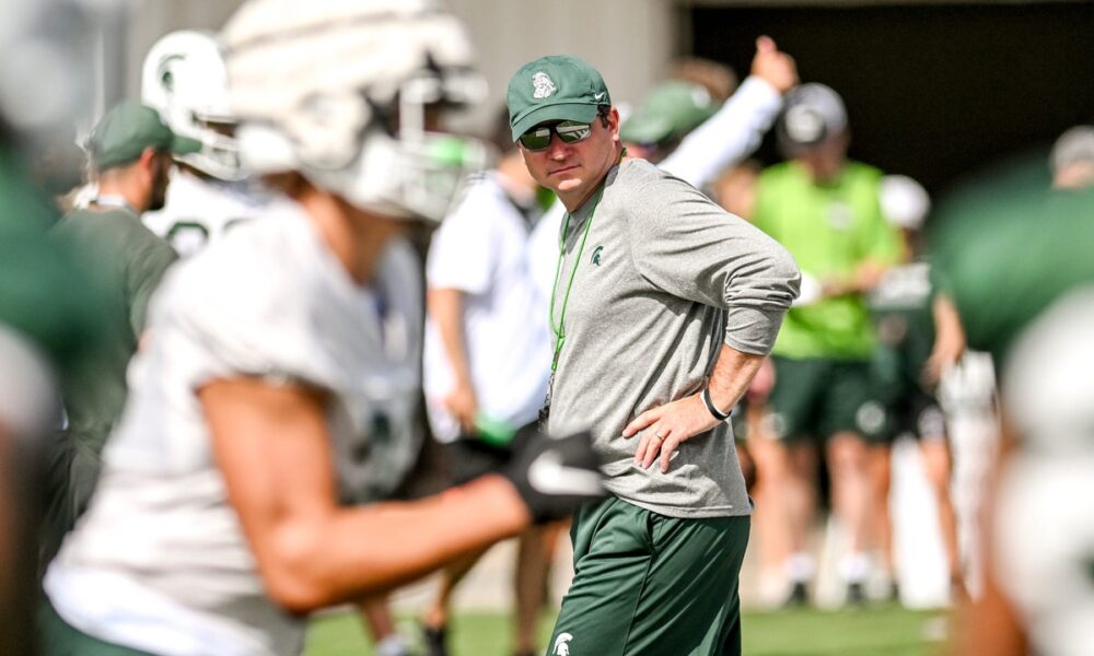 Michigan State football coach Jonathan Smith looks on during practice.