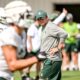 Michigan State football coach Jonathan Smith looks on during practice.