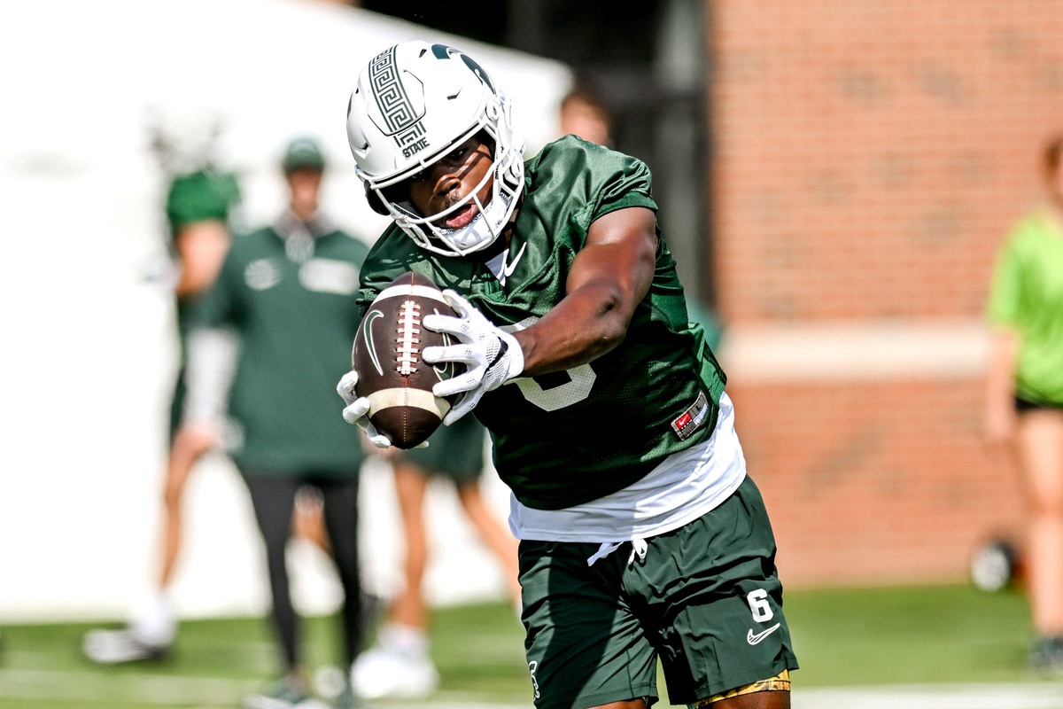 Michigan State football receiver Nick Marsh catches a pass.