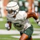 Jordan Hall runs through a drill at Michigan State football fall practice.