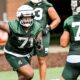 Michigan State football lineman Kristian Phillips runs a drill during fall camp.