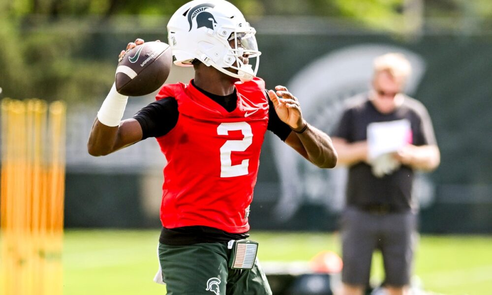 Michigan State football QB1 Aidan Chiles warms up during fall camp.