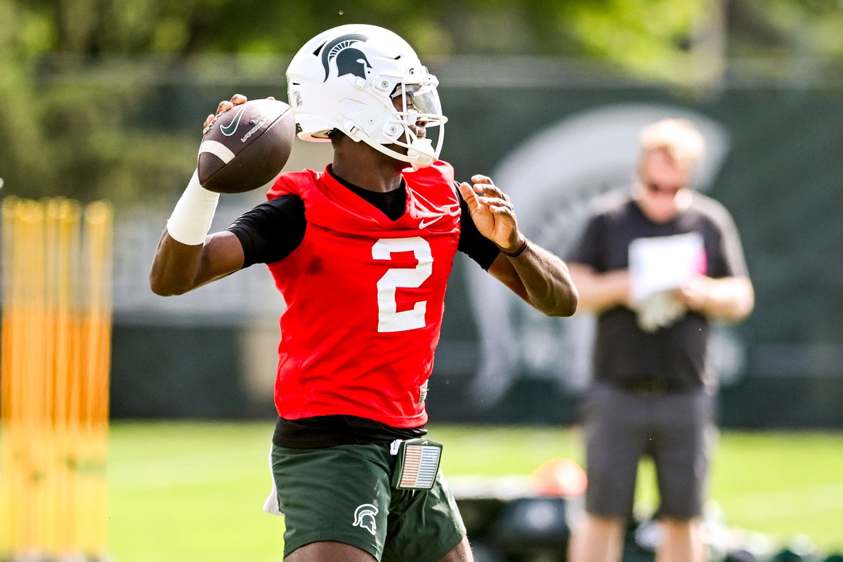 Michigan State football QB1 Aidan Chiles warms up during fall camp.