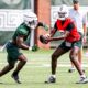 Michigan State football QB1 Aidan Chiles hands off to Nate Carter.