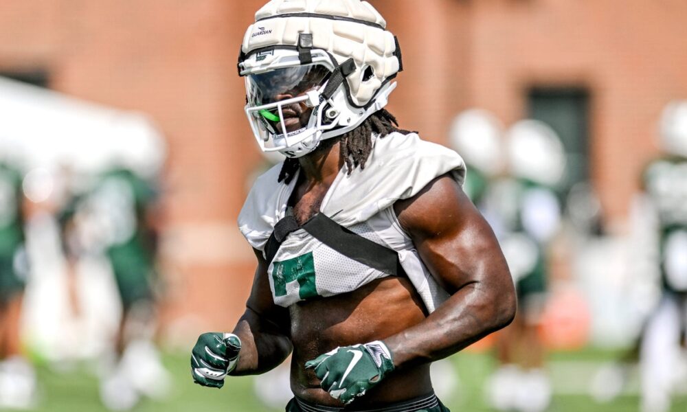 Michigan State football linebacker Jordan Turner warms up during fall camp.