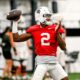 Michigan State football quarterback Aidan Chiles warms up during fall camp.