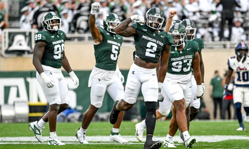 Michigan State football defense celebrates a sack against FAU.