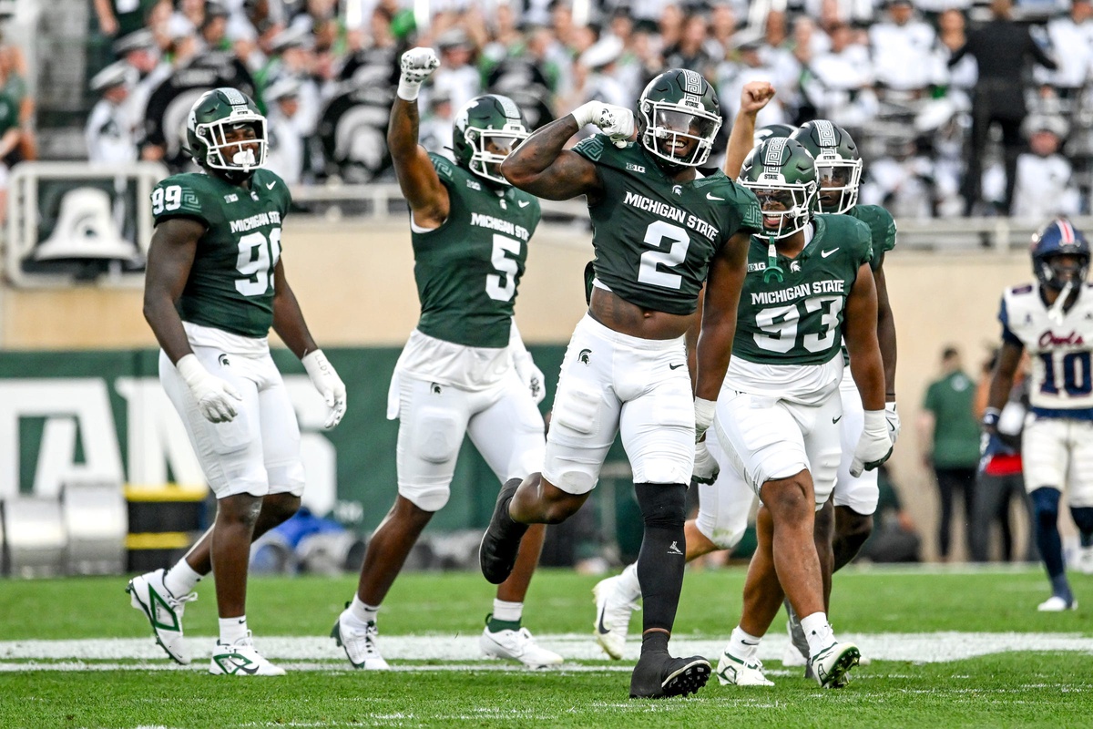 Michigan State football defense celebrates a sack against FAU.