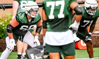 Michigan State football lineman Gavin Broscious goes through a fall camp drill.