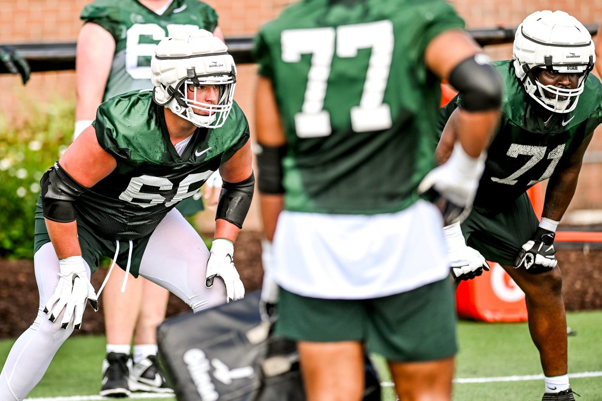 Michigan State football lineman Gavin Broscious goes through a fall camp drill.