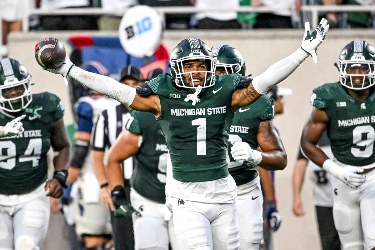 Michigan State football defensive back Nikai Martinez celebrates an interception.