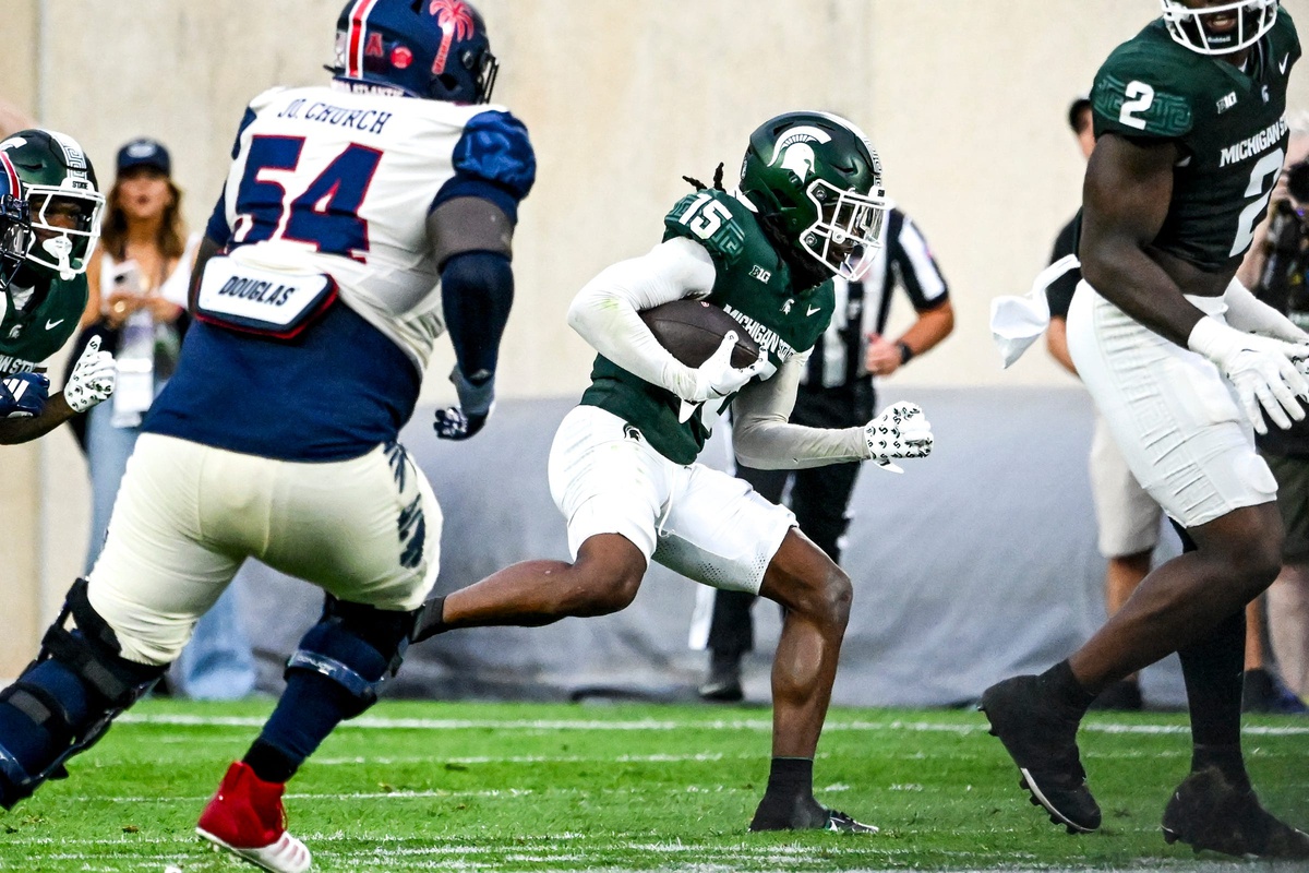 Michigan State football defensive back Angelo Grose returns an interception vs. FAU.