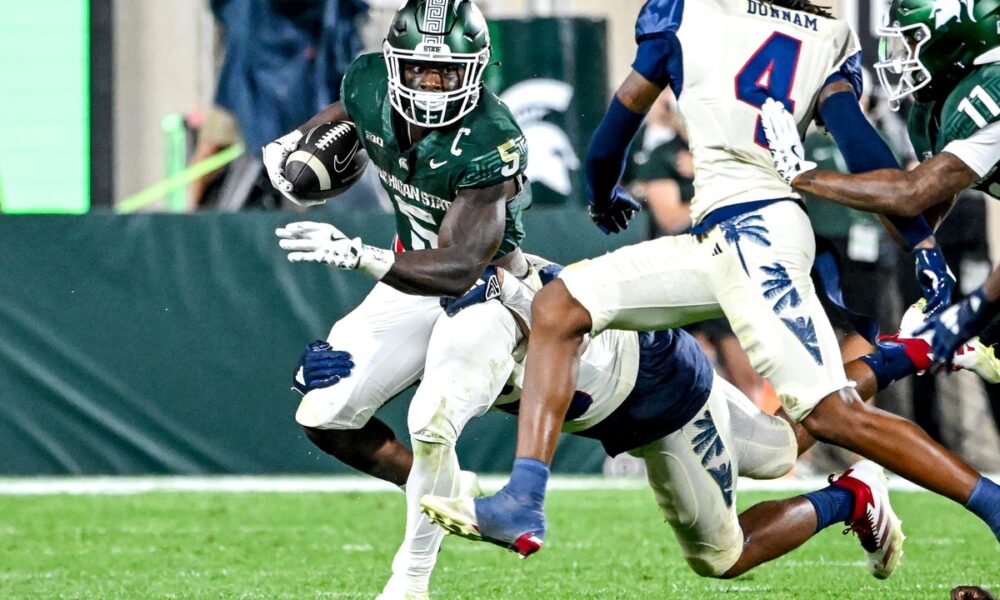 Michigan State football running back Nate Carter runs vs. FAU