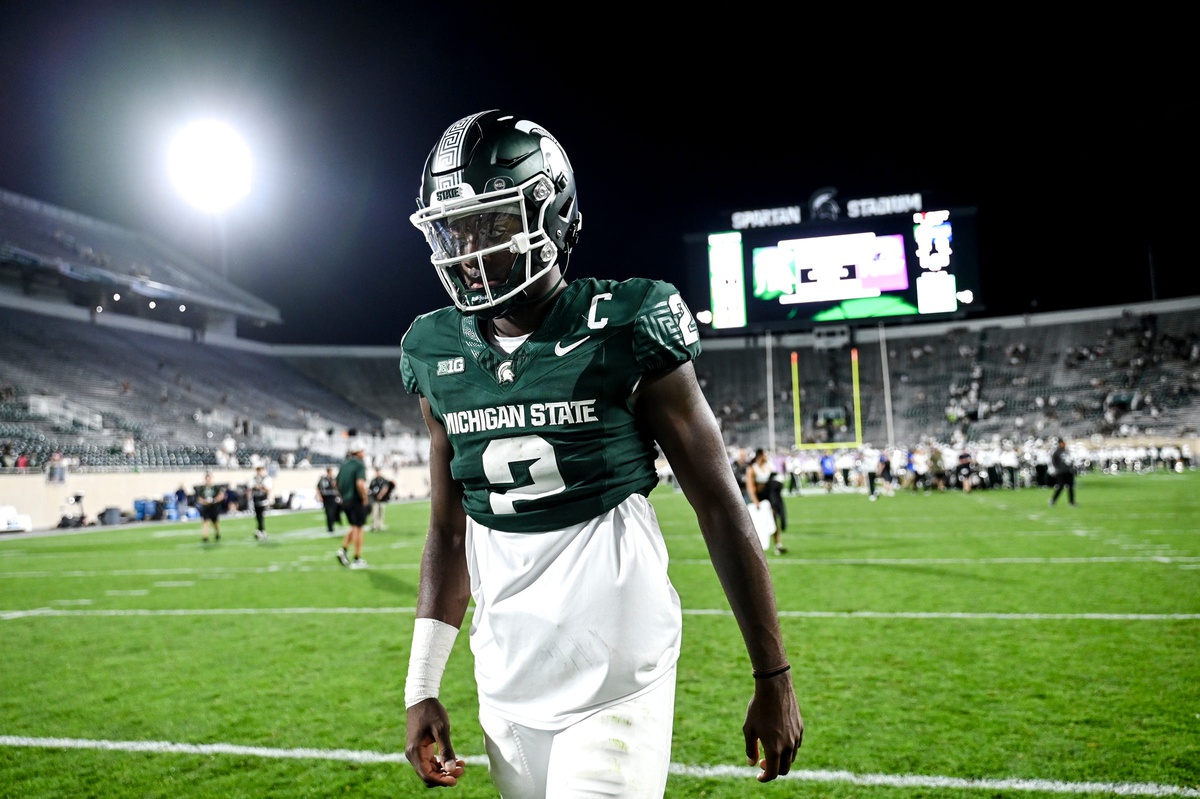 Michigan State football QB1 Aidan Chiles walks off the field after the FAU win.