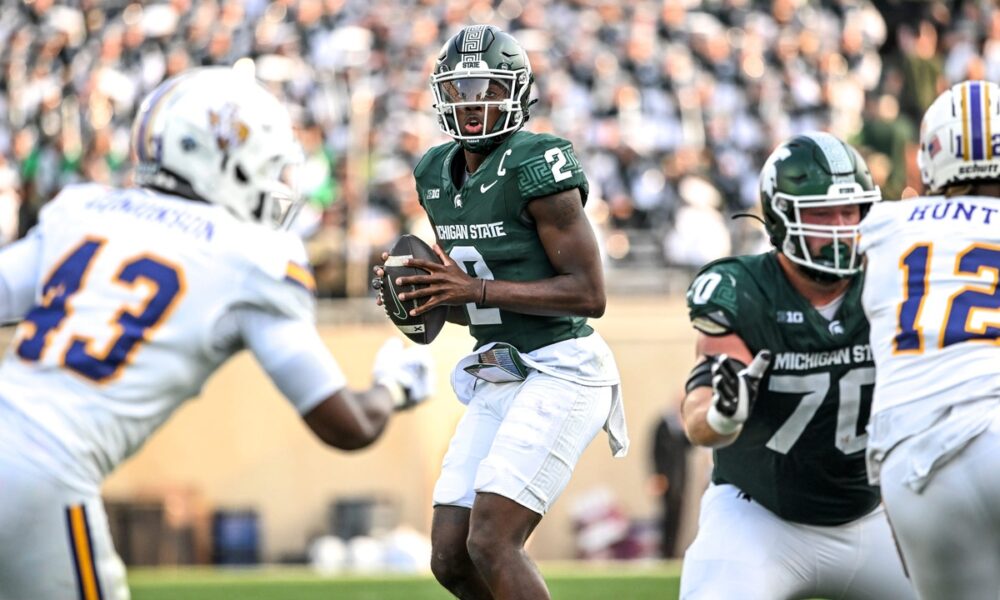 Michigan State football quarterback Aidan Chiles throws a pass