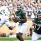 Michigan State football quarterback Aidan Chiles throws a pass