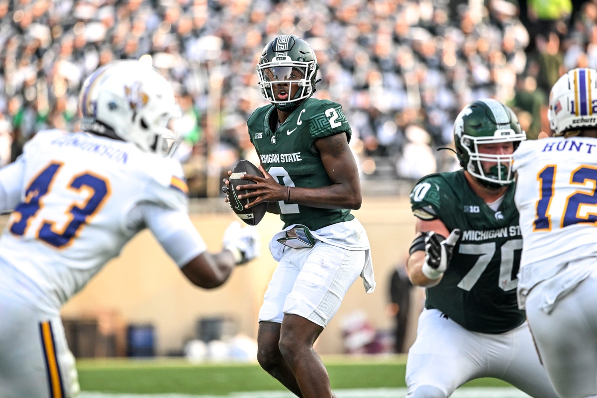 Michigan State football quarterback Aidan Chiles throws a pass