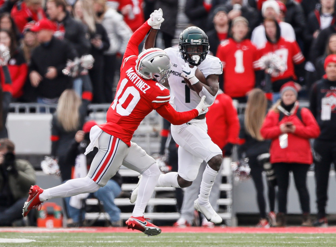 Michigan State football receiver Jayden Reed runs with the ball against Ohio State in 2021