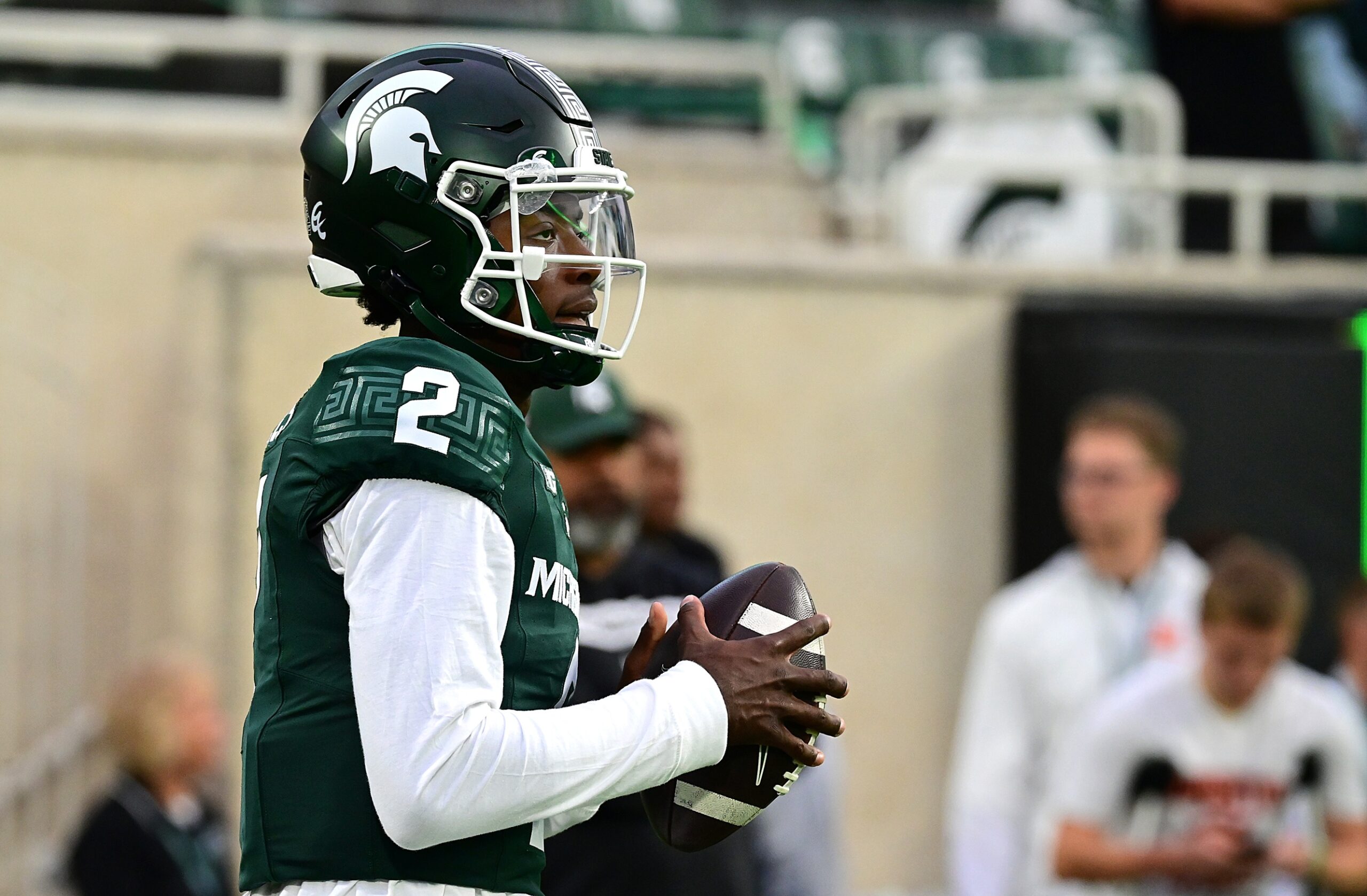 Michigan State football quarterback Aidan Chiles warms up