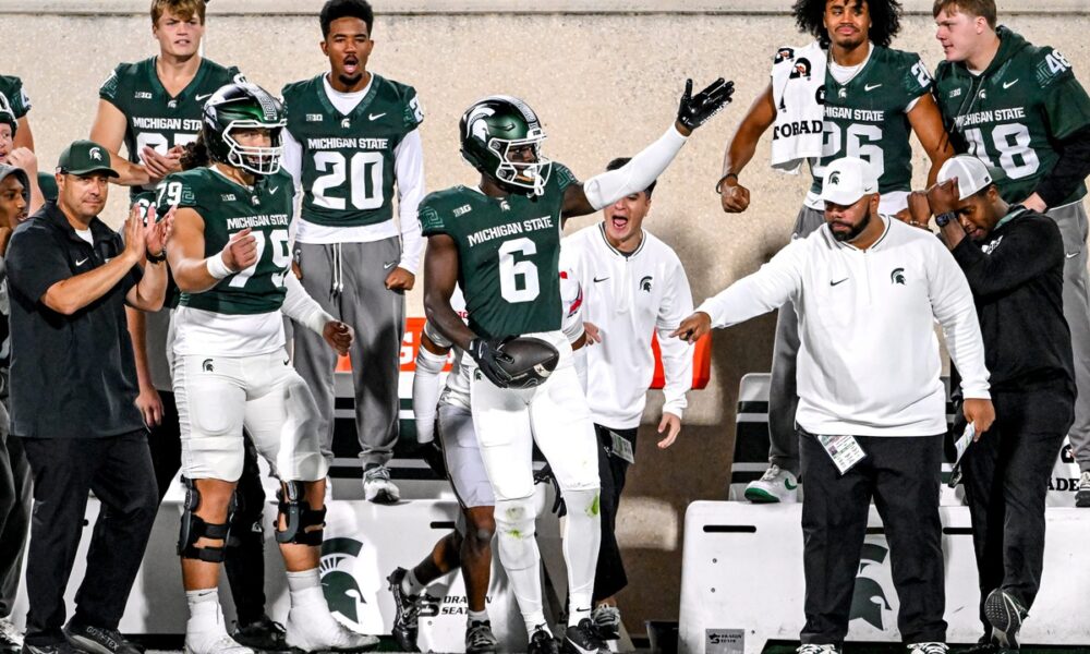 Michigan State football receiver Nick Marsh celebrates a first down.