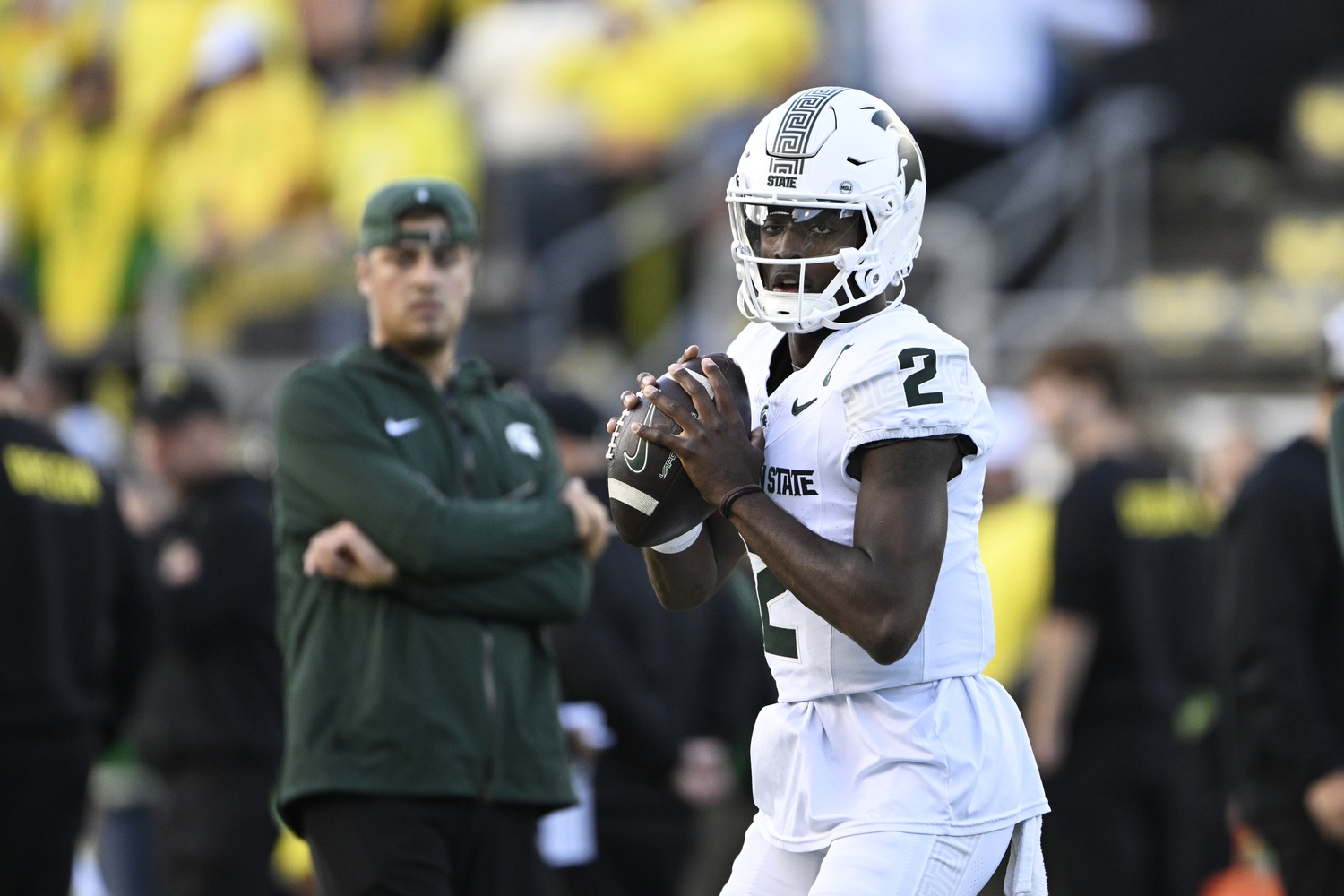 Michigan State football QB1 Aidan Chiles warms up before the Oregon game.