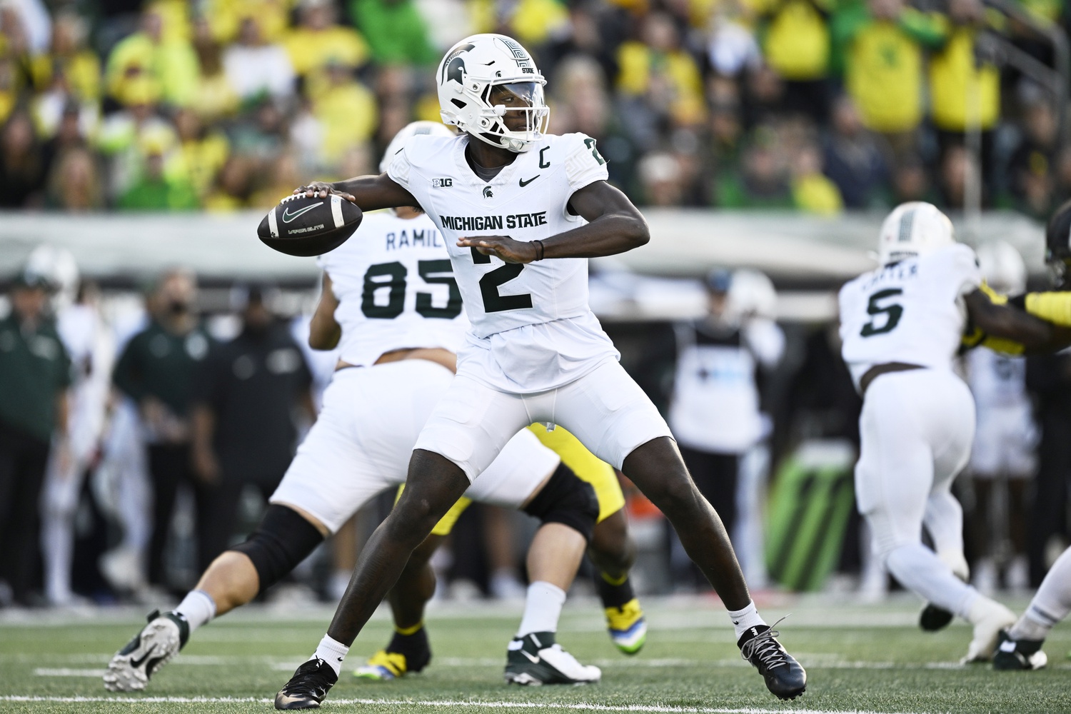 Michigan State football QB1 Aidan Chiles throws the ball.