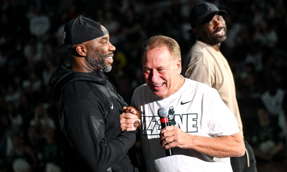 Michigan State basketball coach Tom Izzo laughs with Mateen Cleaves at 2024 Midnight Madness.