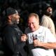 Michigan State basketball coach Tom Izzo laughs with Mateen Cleaves at 2024 Midnight Madness.