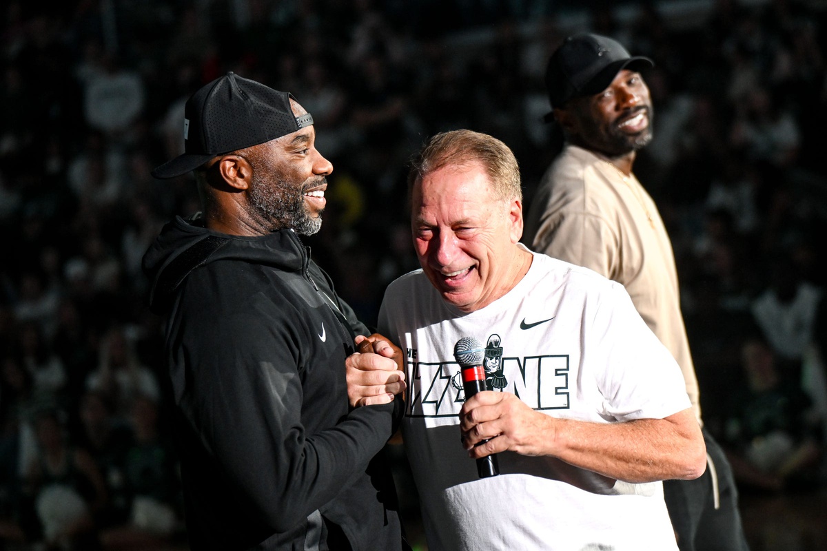 Michigan State basketball coach Tom Izzo laughs with Mateen Cleaves at 2024 Midnight Madness.