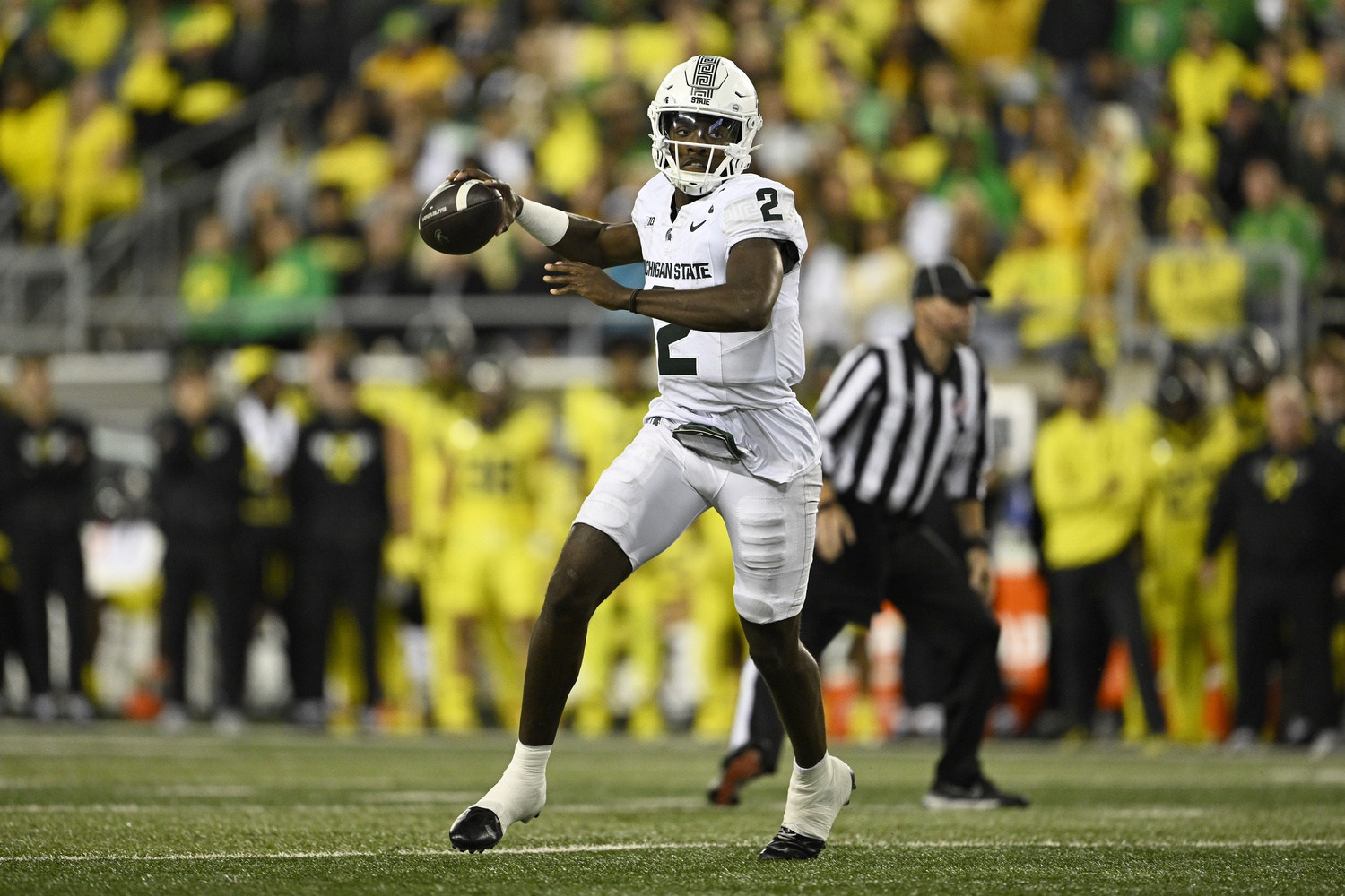 Aidan Chiles passes the ball against Oregon