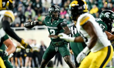 Michigan State football quarterback Aidan Chiles throws a pass