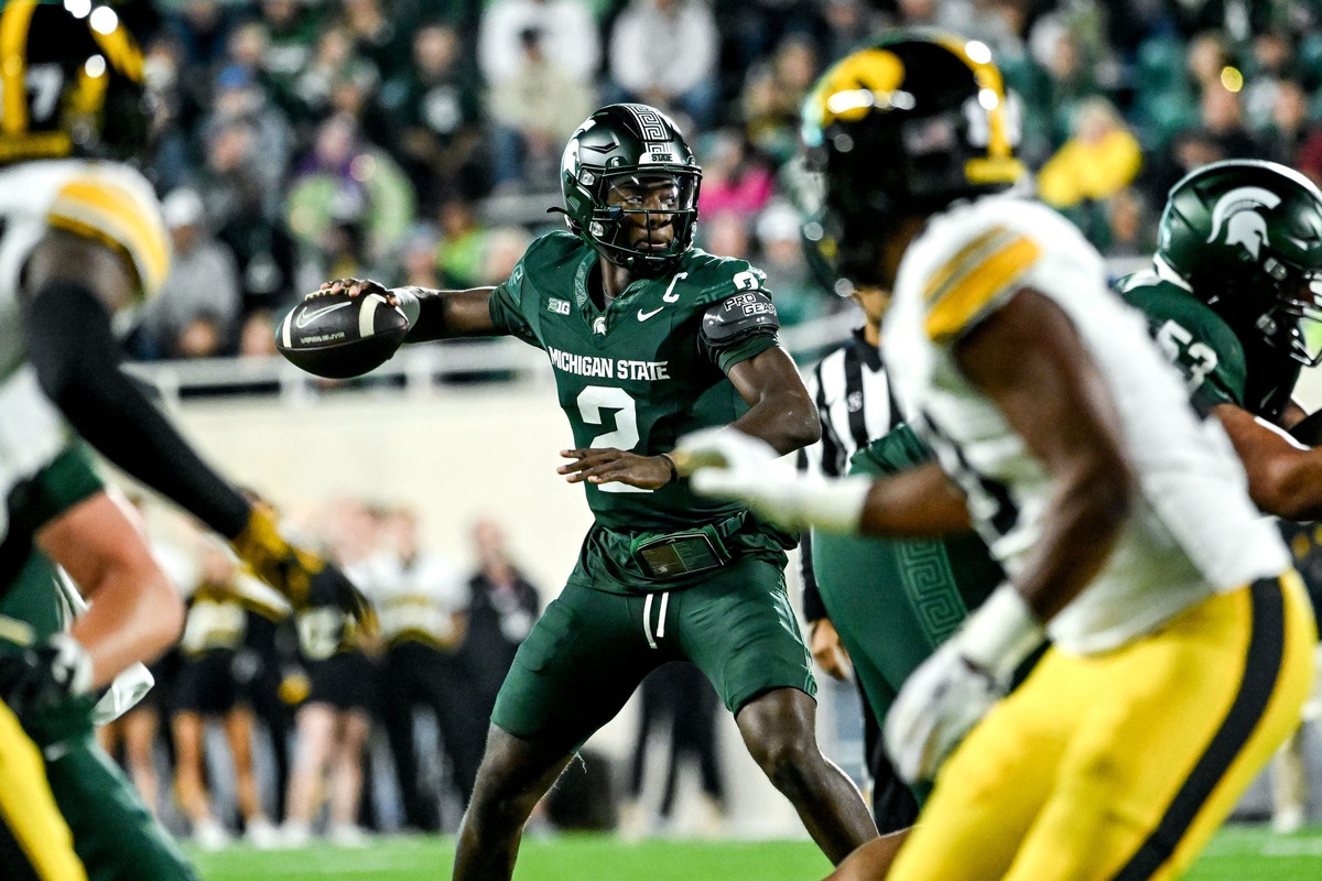 Michigan State football quarterback Aidan Chiles throws a pass