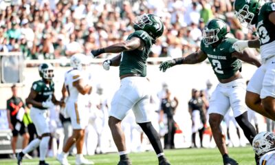 Michigan State football DE Ken Talley celebrates a sack.